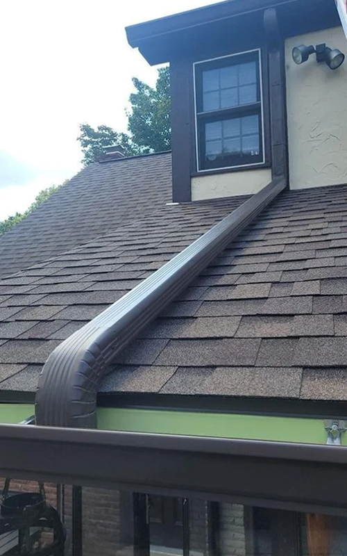 Buccos Roofing crew installing seamless gutters