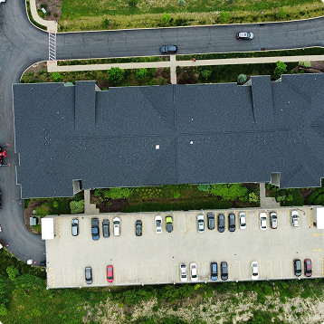 Buccos Roofing crew working on a commercial roof